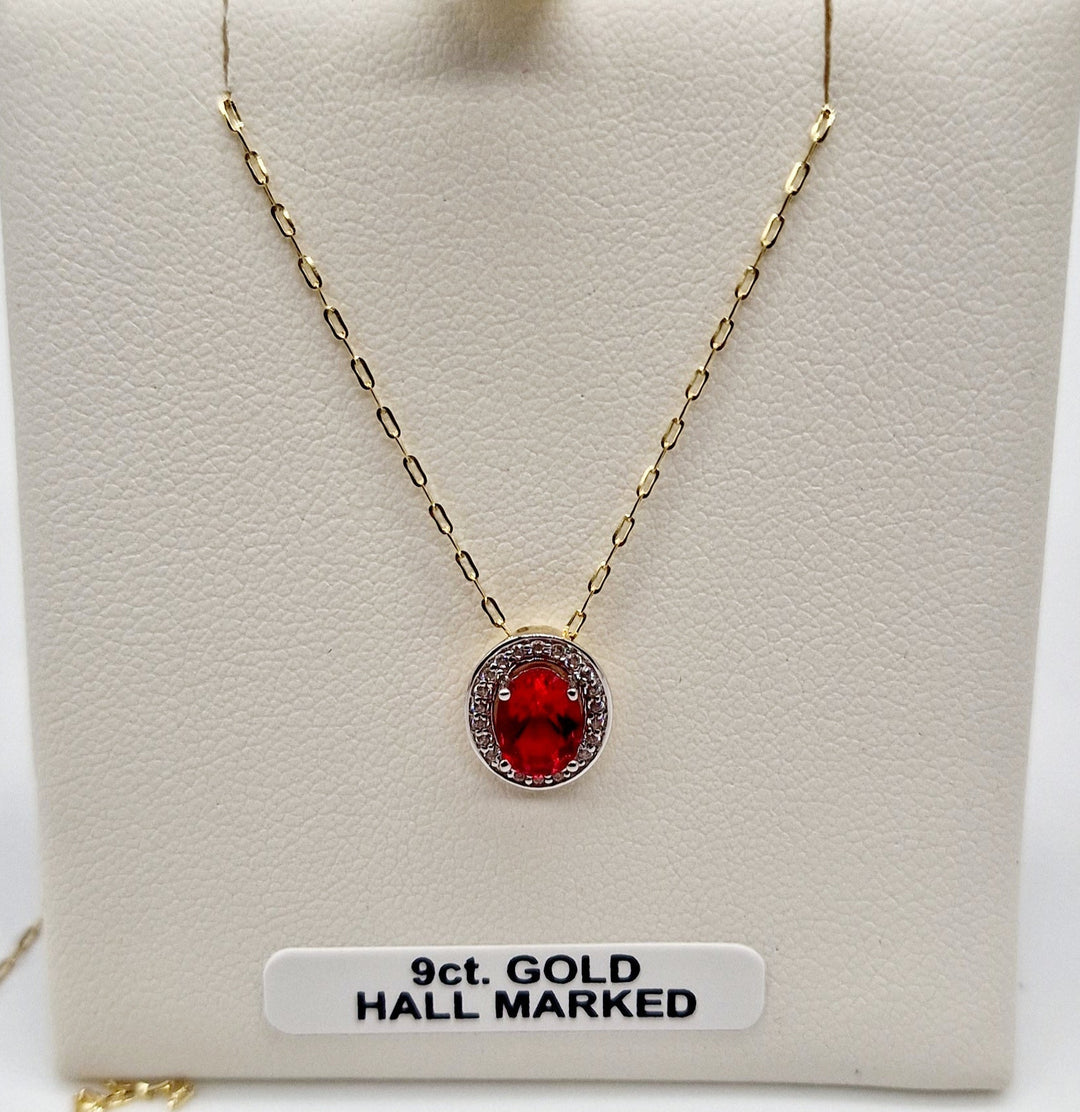 Ruby Pendant In 9ct Gold With Diamond Surround