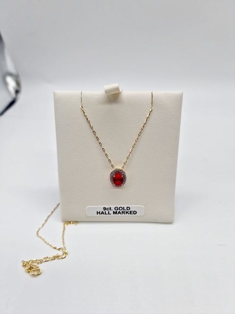 Ruby Pendant In 9ct Gold With Diamond Surround